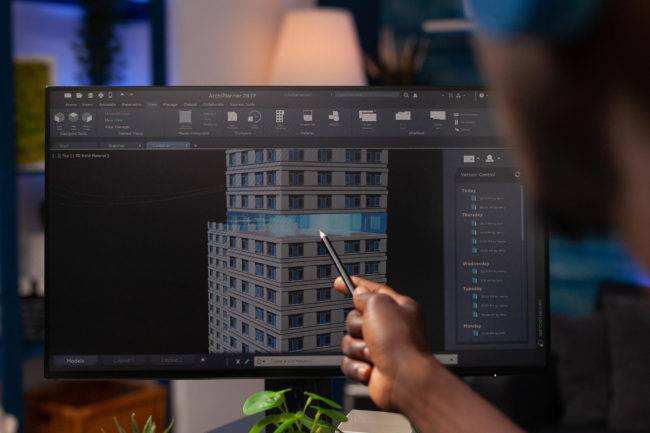 architect engineer pointing architectural building prototype analyzing construction model computer businessman designer working remote from home real estate project modeling sketch 1 650x433 1